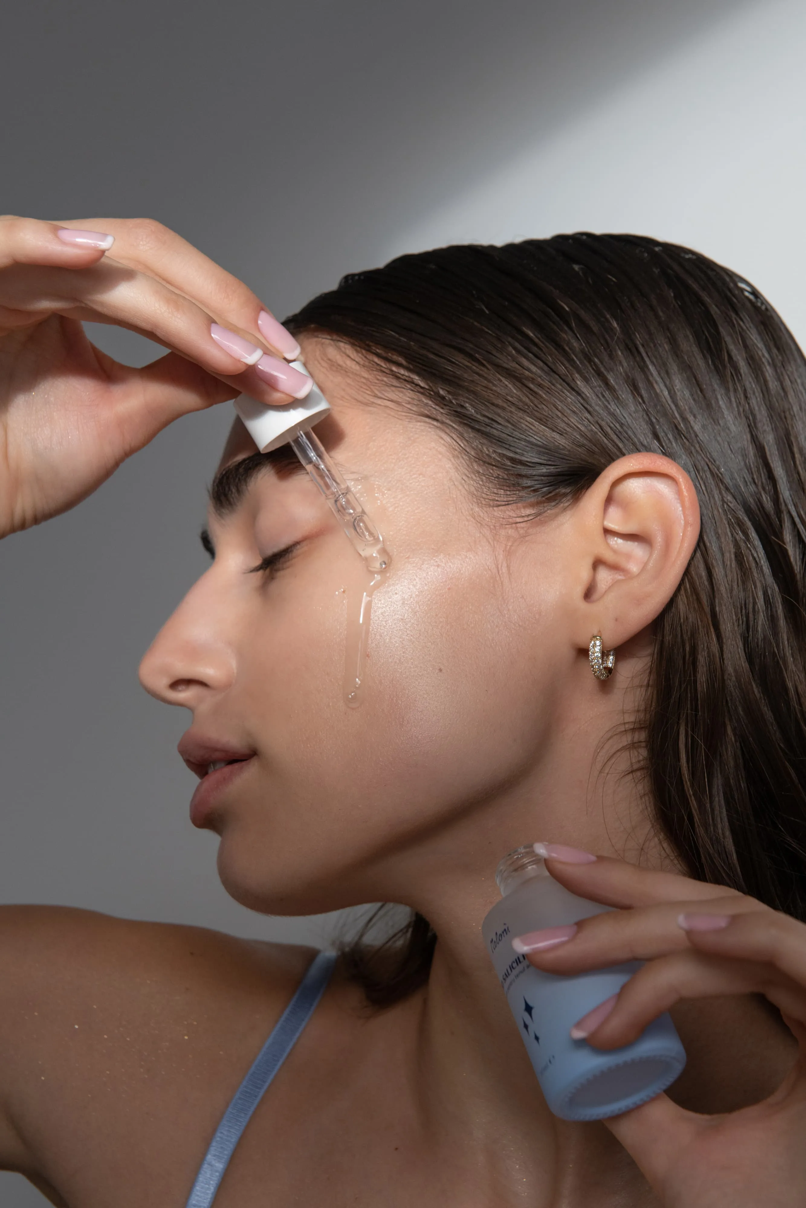 Meloni Model Applying Serum Dropper Skincare Routine - branding project by Fact & Form