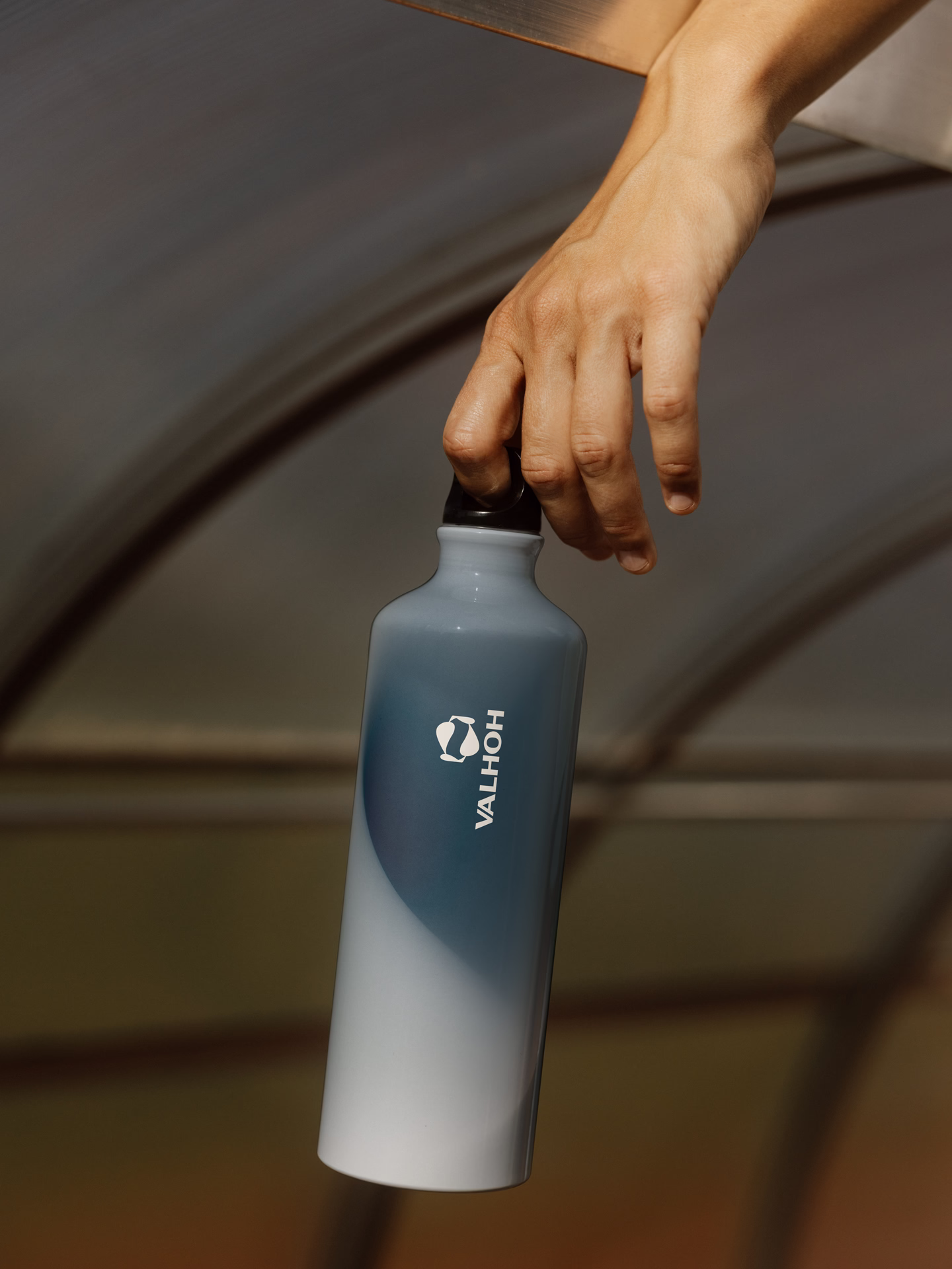 Valhoh branded beverage bottle photographed on a studio backdrop